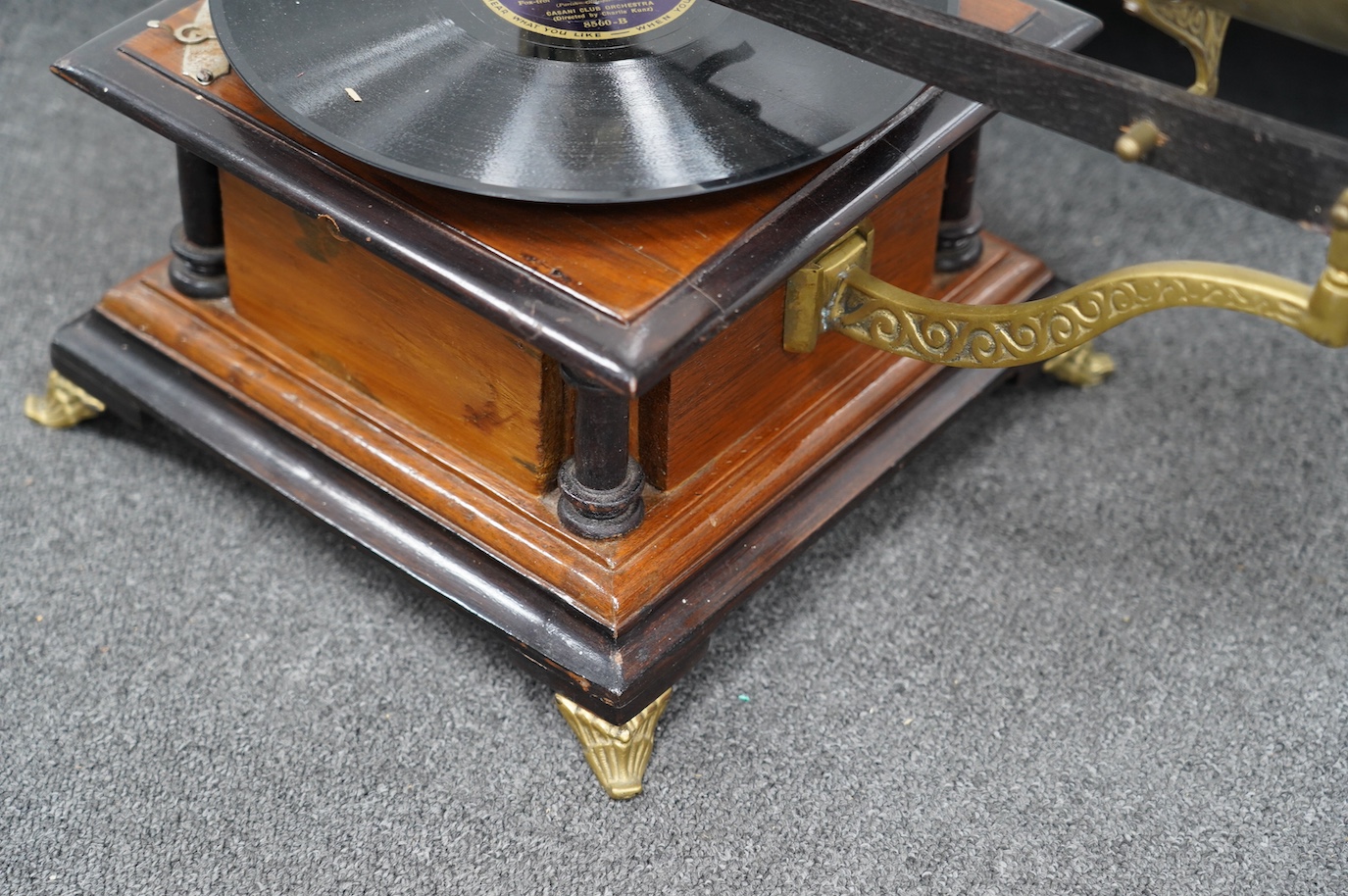 An early 20th century ‘His Masters Voice’ mahogany and ebonised gramophone with brass horn, base 29 x 29cm. Condition - fair